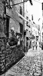 Narrow alley along buildings