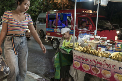 Woman standing on display at market stall