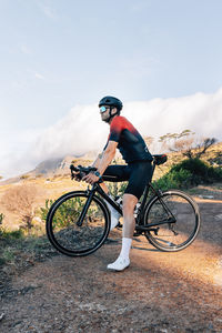 Man riding bicycle on road