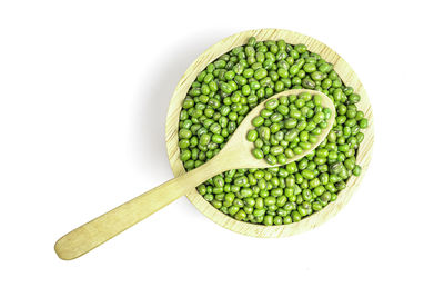 High angle view of green beans against white background