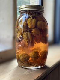 Close-up of glass of jar on table