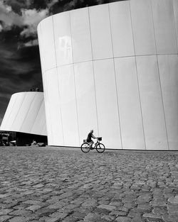 Man riding bicycle on street