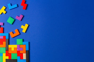 Close-up of toys against blue background