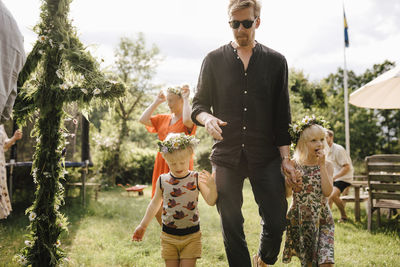 Father with children celebration midsummer