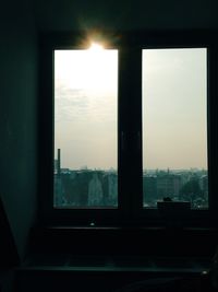 View of cityscape through window