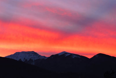 Scenic view of silhouette mountains against romantic sky, on the tuscan emilian apennines