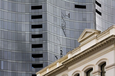 Low angle view of modern and historic building