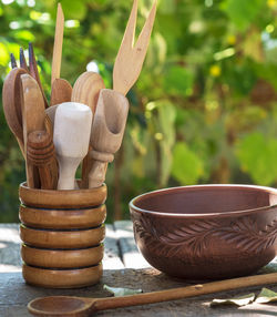 Close-up of wooden spoons in container on table