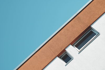 Low angle view of building against clear blue sky