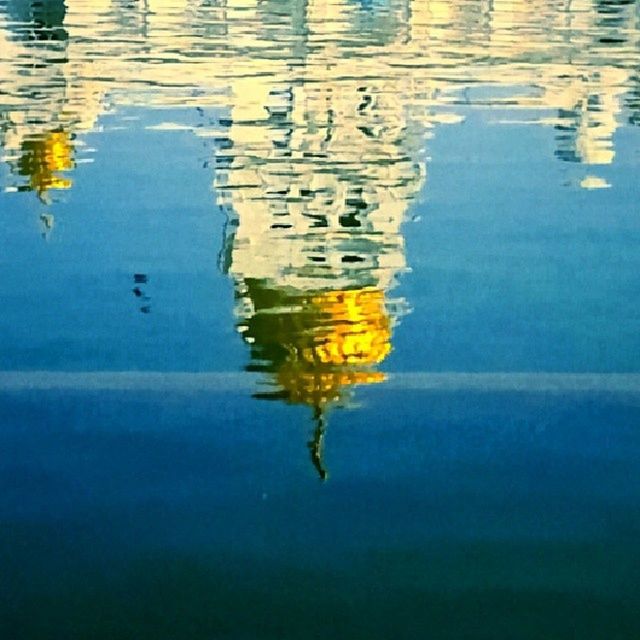 water, reflection, waterfront, lake, rippled, floating on water, high angle view, standing water, water surface, swimming, nature, tranquility, no people, animal themes, bird, outdoors, blue, beauty in nature, day, wildlife