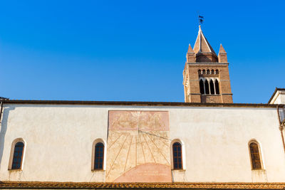 Low angle view of building against clear blue sky