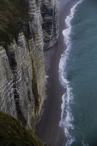 Scenic view of sea with mountain range in background