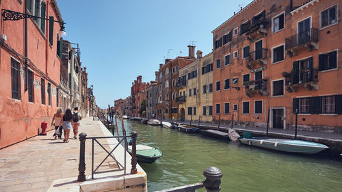 View of canal passing through city buildings