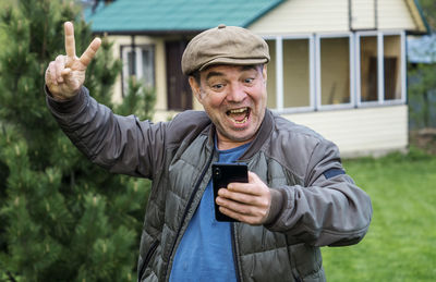 Portrait of man using mobile phone