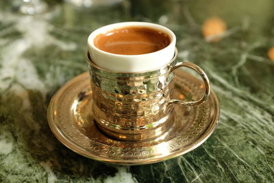Close-up of coffee cup on table