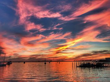 Scenic view of sea against orange sky