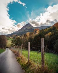 Scenic view of landscape and mountains against sky