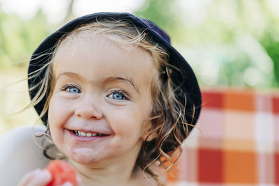 Close-up portrait of smiling innocent girl