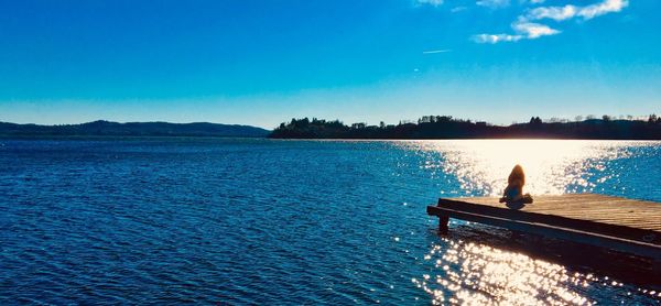 Scenic view of lake against blue sky