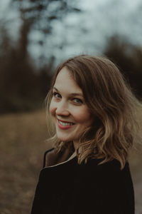 Portrait of smiling young woman