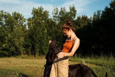 Young woman sitting on a field