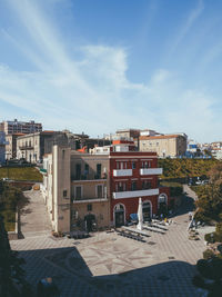 High angle view of buildings against sky on sunny day