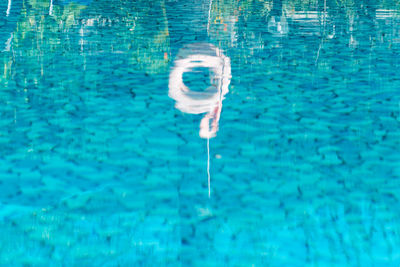 High angle view of swimming in pool