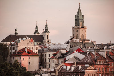 View of buildings in town against sky