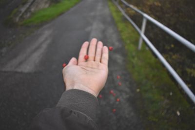 High angle view of person hand on street