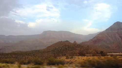 View of mountain range against cloudy sky