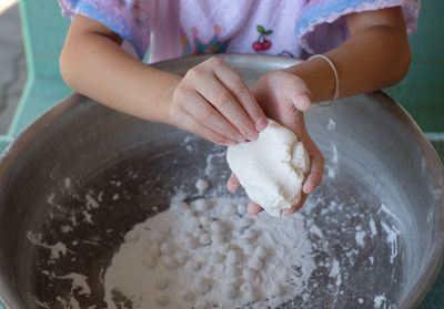 Midsection of woman preparing food