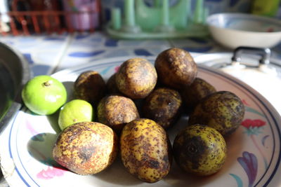 High angle view of fruits in plate on table