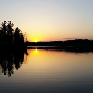 Scenic view of sunset over lake
