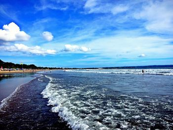 Scenic view of sea against cloudy sky