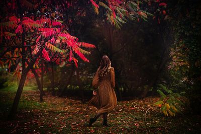 Woman walking on field during autumn