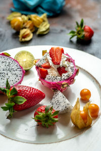 High angle view of fruits in plate on table