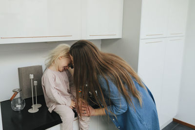 Girl and woman at home