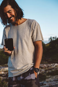 Young man using mobile phone