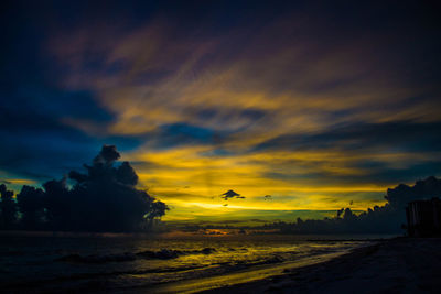 Scenic view of sea against cloudy sky