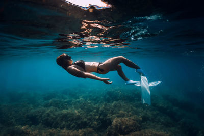 Man swimming in sea