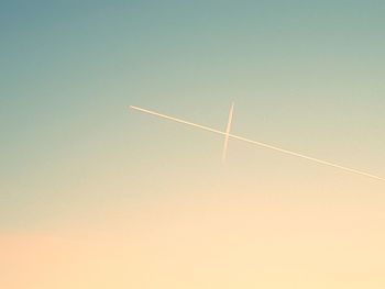 Low angle view of vapor trail against clear sky