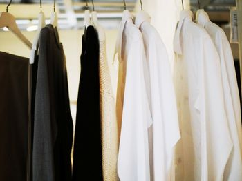 Clothes hanging on rack in store