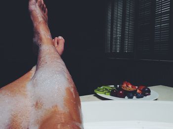 Cropped image of person eating food