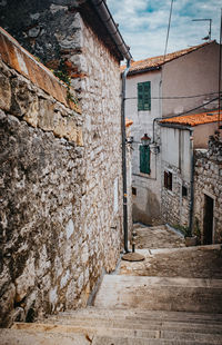 Narrow alley amidst buildings in town