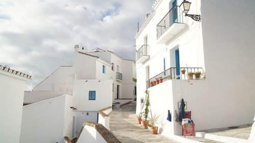 Houses in town against sky