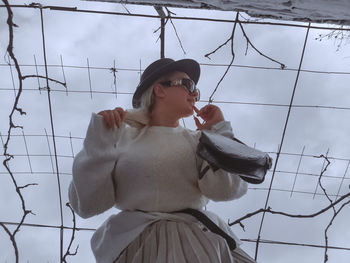 Portrait of young woman holding umbrella