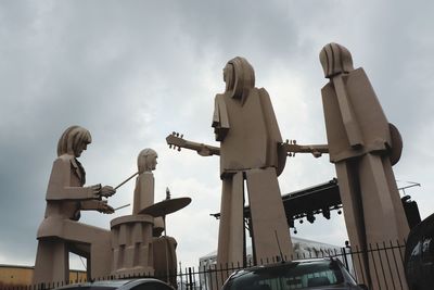 Low angle view of statue against sky