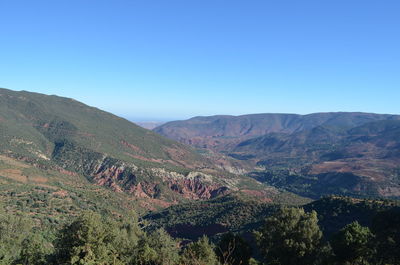 Scenic view of mountains against clear blue sky
