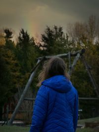 Rear view of woman in park during winter