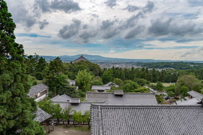 High angle view of trees and buildings against sky